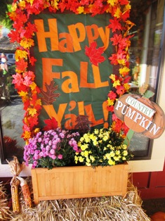 A warm welcome comes your way by this fall festival sign.