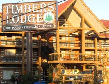 Enjoy the look and feel of a real log cabin at this Pigeon Forge Hotels Timbers Lodge.